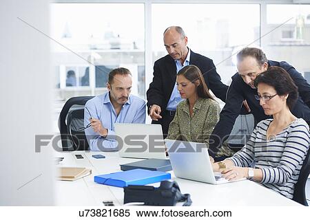 Businesspeople in brainstorming meeting View Large Photo Image Stock Photography - Businesspeople in brainstorming meeting. Fotosearch
