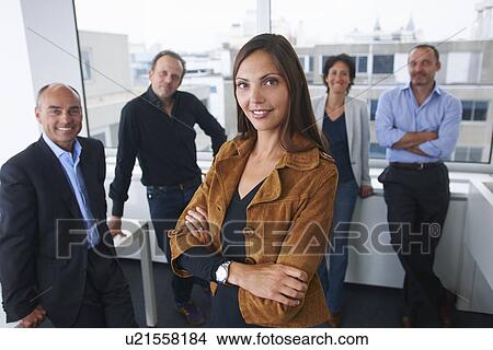 Businesspeople posing for group portrait in office View Large Photo Image Picture - Businesspeople posing for group portrait in office. Fotosearch