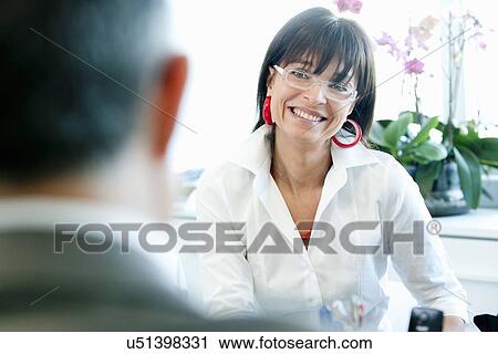 Businesswoman and man in discussion View Large Photo Image Stock Image - Businesswoman and man in discussion. Fotosearch
