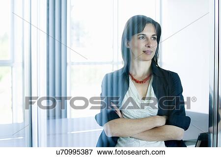 Businesswoman behind glass wall View Large Photo Image Stock Photo - Businesswoman behind glass wall. Fotosearch