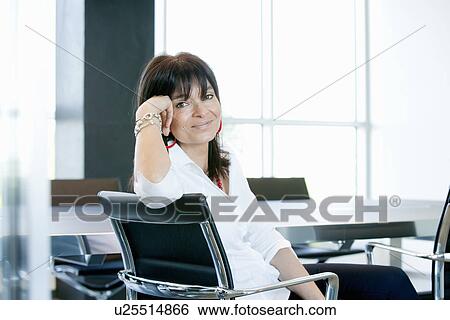 Businesswoman in meeting room View Large Photo Image Stock Photograph - Businesswoman in meeting room. Fotosearch