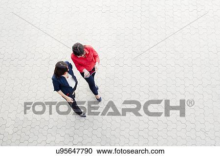 Businesswomen using digital tablet View Large Photo Image Stock Image - Businesswomen using digital tablet. Fotosearch