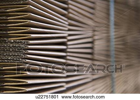 Stock Image - Close up of cardboard stock warehouse. Fotosearch