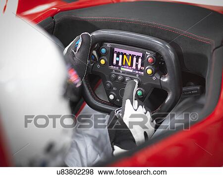 Close up of driver in supercar cockpit View Large Photo Image Stock Photo - Close up of driver in supercar cockpit. Fotosearch