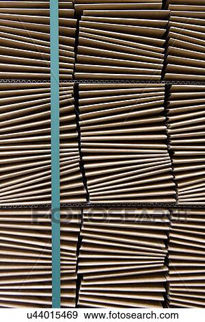 Close up of folded cardboard stock warehouse View Large Photo Image Stock Photo - Close up of folded cardboard stock warehouse. Fotosearch