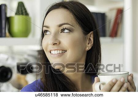 Close up of young woman with coffee cup View Large Photo Image Stock Photo - Close up of young woman with coffee cup. Fotosearch