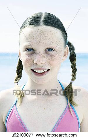 Close up portrait of girl with pigtails at coast View Large Photo Image Stock Photo - Close up portrait of girl with pigtails at coast. Fotosearch