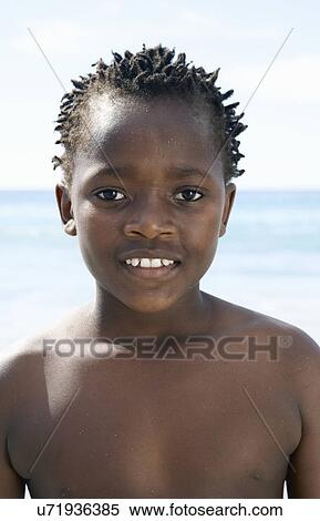 Close up portrait of smiling boy at coast View Large Photo Image Stock Photography - Close up portrait of smiling boy at coast. Fotosearch