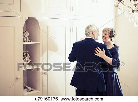 Couple dancing in bedroom View Large Photo Image Stock Photograph - Couple dancing in bedroom. Fotosearch