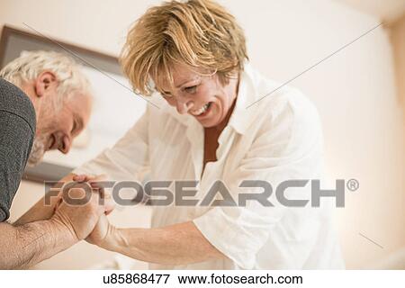 Stock Photo - Couple playfighting. Fotosearch