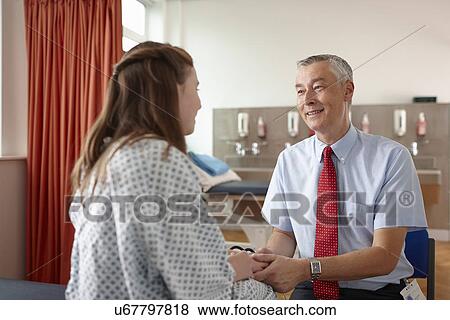 Doctor holding patient's hands View Large Photo Image Stock Photo - Doctor holding patient's hands. Fotosearch