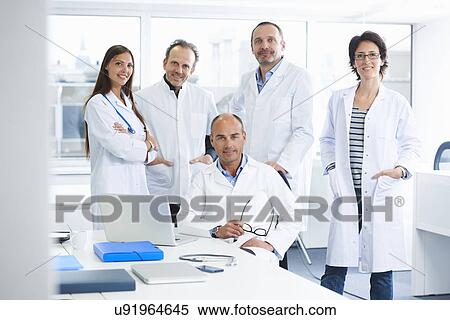 Doctors posing for group portrait View Large Photo Image Stock Photography - Doctors posing for group portrait. Fotosearch