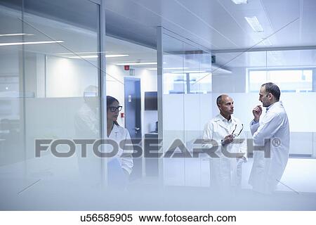 Stock Photography - Doctors taking break in office. Fotosearch
