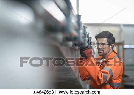 Engineer inspecting marine fabrication used for cable laying, close up View Large Photo Image Stock Image - Engineer inspecting marine fabrication used for cable laying, close up. Fotosearch