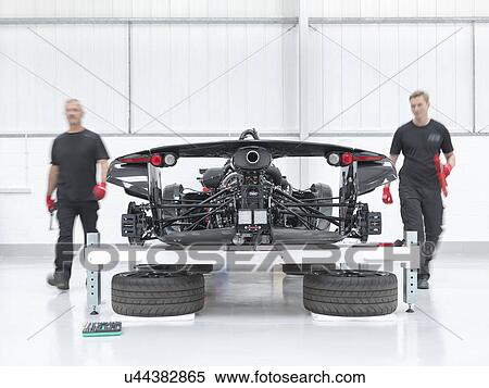 Engineers assembling supercar in sports car factory View Large Photo Image Stock Photography - Engineers assembling supercar in sports car factory. Fotosearch