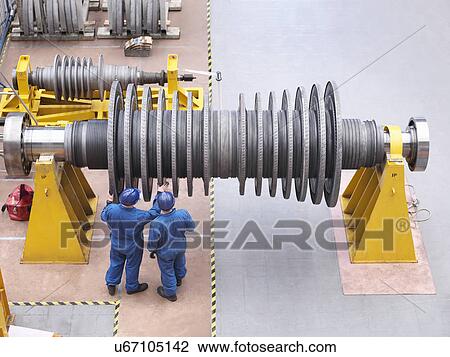 Engineers inspecting turbine during power station outage, high angle view View Large Photo Image Stock Image - Engineers inspecting turbine during power station outage, high angle view. Fotosearch