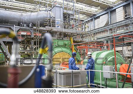 Engineers inspecting turbine housing during power station outage View Large Photo Image Stock Image - Engineers inspecting turbine housing during power station outage. Fotosearch