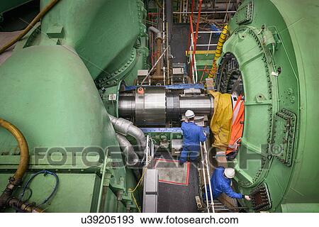 Engineers working on turbine housing repair during power station outage, high angle view View Large Photo Image Stock Image - Engineers working on turbine housing repair during power station outage, high angle view. Fotosearch