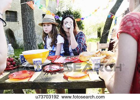 Group of friends having a picnic View Large Photo Image Stock Image - Group of friends having a picnic. Fotosearch