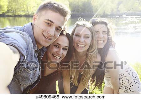 Group of friends in sunlight, posing View Large Photo Image Stock Photography - Group of friends in sunlight, posing. Fotosearch