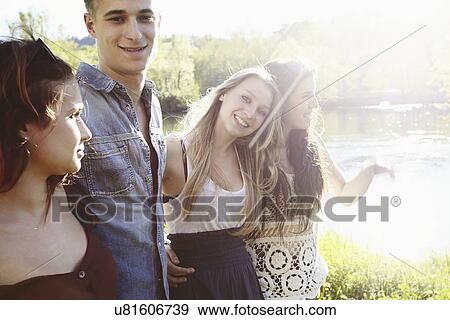 Group of friends in sunlight View Large Photo Image Stock Photo - Group of friends in sunlight. Fotosearch