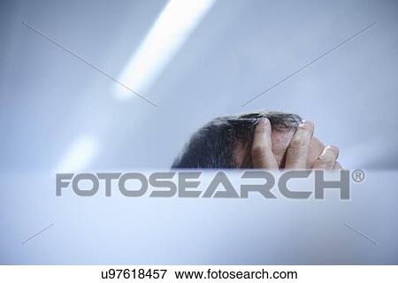 Hand on man's forehead View Large Photo Image Stock Photo - Hand on man's forehead. Fotosearch