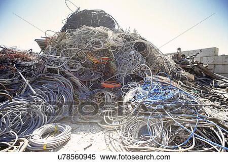 Heap of coiled and tangled cables in scrap metal yard View Large Photo Image Stock Photography - Heap of coiled and tangled cables in scrap metal yard. Fotosearch