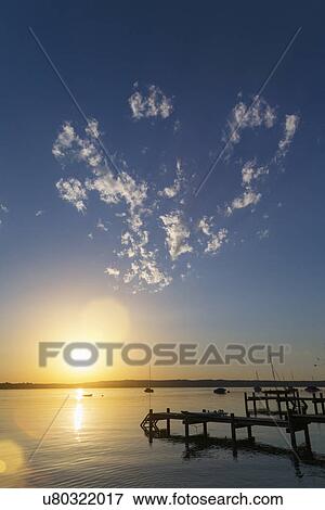 Heart shaped clouds at sunset, Lake Starnberg, Bavaria, Germany View Large Photo Image Stock Photo - Heart shaped clouds at sunset, Lake Starnberg, Bavaria, Germany. Fotosearch