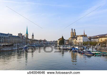 Stock Photograph - Limmat river, Fraumunster church, Grossmunster church Zurich, Switzerland. Fotosearch