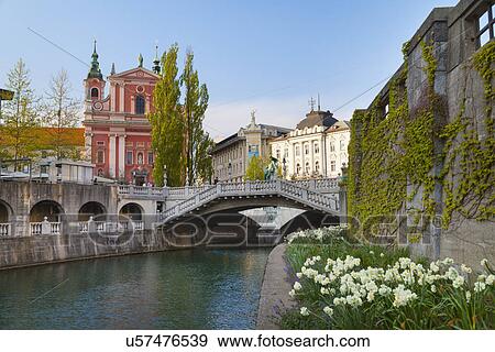 Stock Photo - Ljubljana city center, Lublijanaka river, Tromostovje bridge and Franciscan Church of the Annunciation, Slovenia. Fotosearch