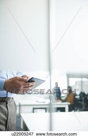Male hands holding digital tablet View Large Photo Image Stock Photo - Male hands holding digital tablet. Fotosearch
