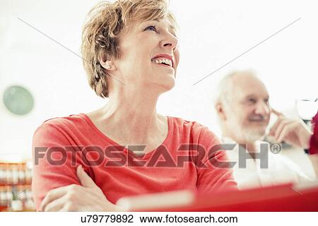 Stock Image - Mature woman smiling, portrait. Fotosearch