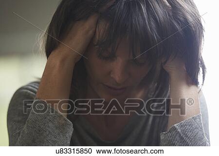 Mature woman with head in hands View Large Photo Image Stock Image - Mature woman with head in hands. Fotosearch