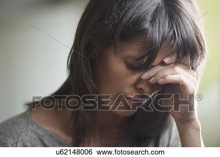 Mature woman with head in hands View Large Photo Image Stock Photograph - Mature woman with head in hands. Fotosearch