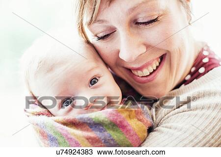 Stock Image - Mother with baby, portrait. Fotosearch