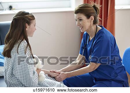 Nurse talking to girl View Large Photo Image Stock Image - Nurse talking to girl. Fotosearch