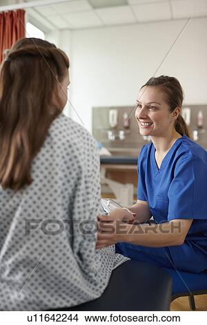 Nurse talking to patient View Large Photo Image Picture - Nurse talking to patient. Fotosearch