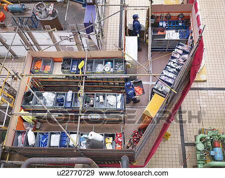 Stock Photo - Overhead view of stores and parts area during power station outage. Fotosearch