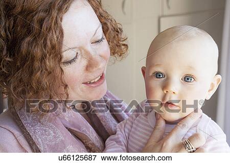Portrait baby girl and mid adult mother View Large Photo Image Stock Photo - Portrait baby girl and mid adult mother. Fotosearch