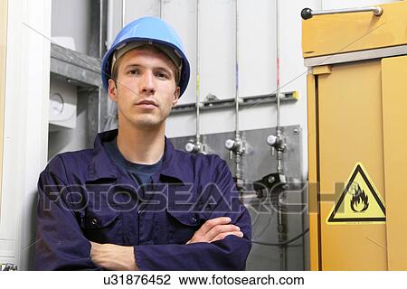 Portrait of confident male electrician in factory View Large Photo Image Stock Image - Portrait of confident male electrician in factory. Fotosearch