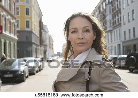 Portrait of confident mature woman in the city View Large Photo Image Stock Photo - Portrait of confident mature woman in the city. Fotosearch