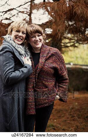Portrait of mature woman and daughter View Large Photo Image Picture - Portrait of mature woman and daughter. Fotosearch
