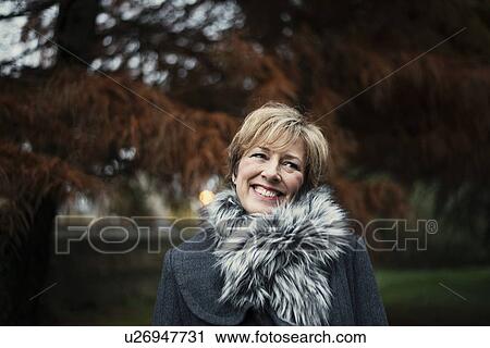 Stock Image - Portrait of mature woman. Fotosearch
