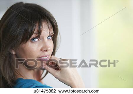 Stock Image - Portrait of mature woman. Fotosearch