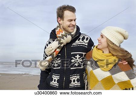 Portrait of mid adult couple strolling on beach, Bloemendaal aan Zee, Netherlands View Large Photo Image Stock Image - Portrait of mid adult couple strolling on beach, Bloemendaal aan Zee, Netherlands. Fotosearch