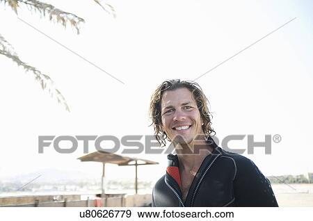 Portrait of mid adult male scuba diver on beach View Large Photo Image Stock Photo - Portrait of mid adult male scuba diver on beach. Fotosearch