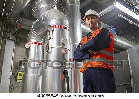 Portrait of mid adult male technician in power station View Large Photo Image Stock Photography - Portrait of mid adult male technician in power station. Fotosearch