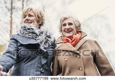 Stock Photo - Portrait of senior woman and daughter. Fotosearch