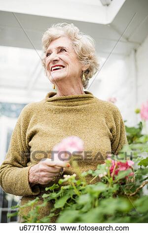 Stock Image - Portrait of senior woman. Fotosearch