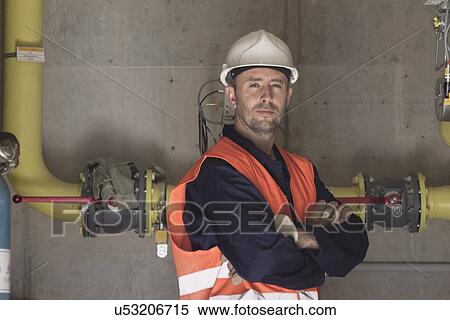 Portrait of technician with arms folded in power station View Large Photo Image Stock Photography - Portrait of technician with arms folded in power station. Fotosearch